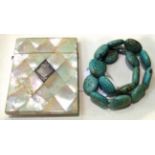 A mother-of-pearl card case and a simulated turquoise necklace
