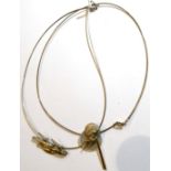 A silver and 9 carat gold 'bird' pendant necklace, on a wire necklet, together with a mother-of-