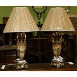 A pair of modern gilt table lamps and shades