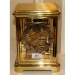 A brass four glass chiming mantel clock, signed Kieninger, with paperwork and box (as new)
