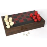 A chess/backgammon games board with stained bone counters
