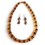 An amber necklace with similar earrings with 925 mounts 58.4g gross.
