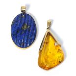 A 9 carat gold amber and diamond pendant, measures 4cm by 2cm, and a 9 carat gold lapis lazuli