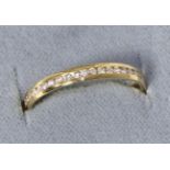 An 18 carat gold diamond set band ring, total estimated diamond weight 0.20 carat approximately,