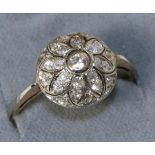 An old cut diamond cluster ring, total estimated diamond weight 0.55 carat approximately, finger