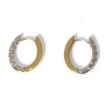 A pair of 18 carat two colour gold diamond cuff earrings, total estimated diamond weight 0.30