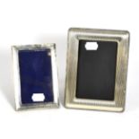 Two rectangular silver photograph frames