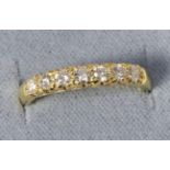 An 18 carat gold diamond half hoop ring, total estimated diamond weight 0.45 carat approximately,