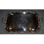 An electroplated twin handled tray with decorative fruiting vine border