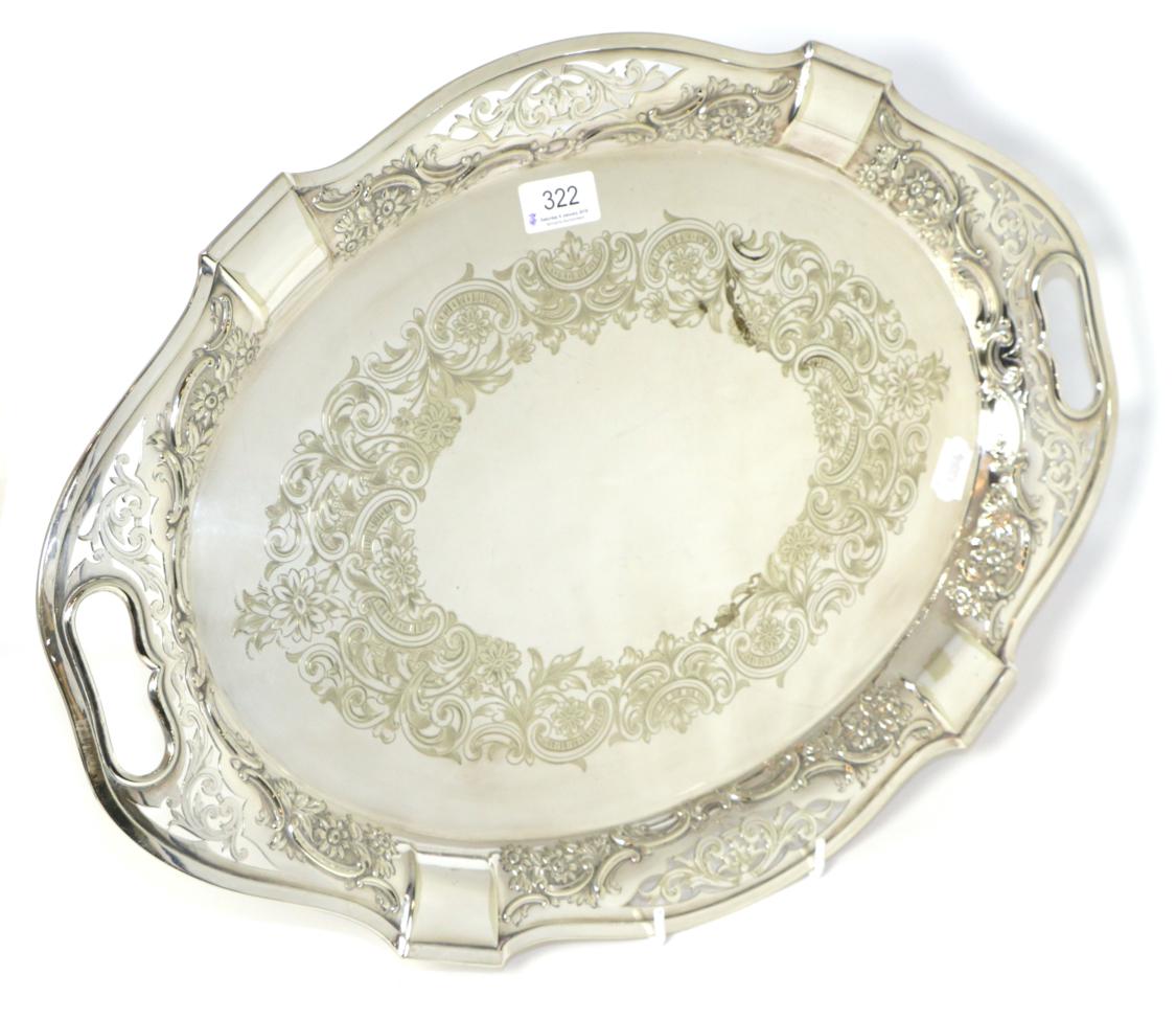 An oval twin-handled electroplated tray with pierced border