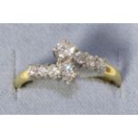 An 18 carat gold diamond cross over ring, to diamond set shoulders, total estimated diamond weight