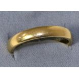 An 18 carat gold band ring, finger size S 6.3g