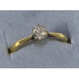 A solitaire diamond ring, an old cut diamond in a claw setting, to knife edge shoulders, estimated