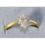 An 18 carat gold marquise cut diamond cluster ring, total estimated diamond weight 0.40 carat