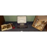 A set of silver handled fruit knives and forks in a fitted case; six silver handled tea knives;
