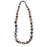 A banded agate and glass bead necklace, a continuous strand of round banded agate beads