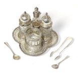A Victorian silver and glass four piece cruet set, by George Fox. London, 1881, with pierced