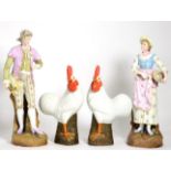 A pair of large Continental bisque porcelain figures and a pair of modern porcelain models of