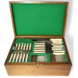 A service of electroplated flatware, twelve place settings, in a fitted oak canteen with two lift-