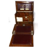 A Victorian correspondence cabinet, with hinged cover and fall front, enclosing a fitted interior