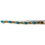 A 9 carat gold turquoise bracelet, five oval cabochon turquoise in rubbed over settings, spaced by