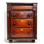A 19th century miniature four drawer chest