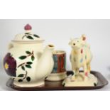 Three pieces of Emma Bridgewater pottery comprising a Hellebore pattern teapot, cow creamer and a