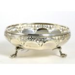 A silver pierced dish, by Fattorini & Sons, Birmingham, 1918, raised on three ball and claw supports
