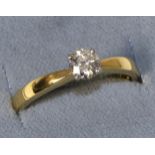 An 18 carat gold diamond solitaire ring, estimated diamond weight 0.40 carat approximately, finger