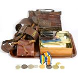 A quantity of photographs, two medals, a small quantity of coins, Sam Brown belt, handbag,