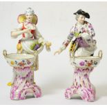 A Pair of Berlin Porcelain Figural Salts, late 19th century, modelled as a vintner and his
