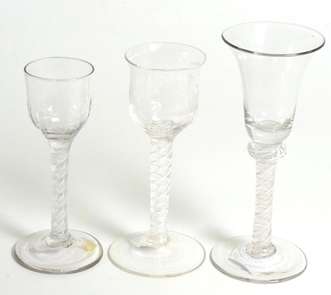 A Wine Glass, circa 1760, the bell shaped bowl on a knopped opaque twist stem, 17cm; and Two Small