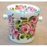 A Wemyss Pottery Pail and Cover, early 20th century, painted with pink roses, painted mark, 29cm