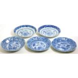 A Set of Three Chinese Porcelain Saucer Dishes, Kangxi, painted in underglaze blue with exotic birds