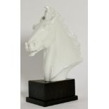 A Meissen Porcelain White Glazed Horse Head, signed and dated Erich Boehme 1949, 17.5cm high, wood