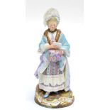 A Meissen Porcelain Figure of a Lady, circa 1900, wearing a lace hat and lace trimmed dress