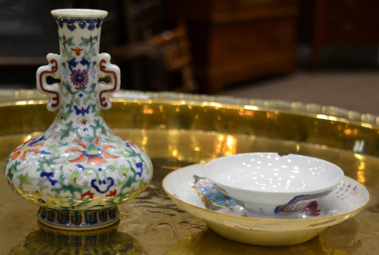 A Chinese Porcelain Bottle Vase, painted in Doucai with scrolling lotus, bears six character