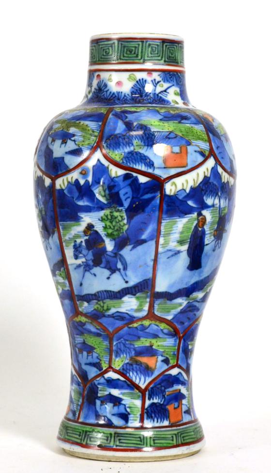 A Chinese Porcelain Baluster Vase, Kangxi, painted in underglaze blue and clobbered with panels of