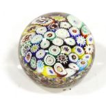 A Millefiore Glass Paperweight, containing various canes, 8cm diameter