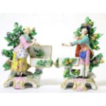 A Pair of Chelsea Style Porcelain Sweetmeat Figures, circa 1900, as 18th century figures standing