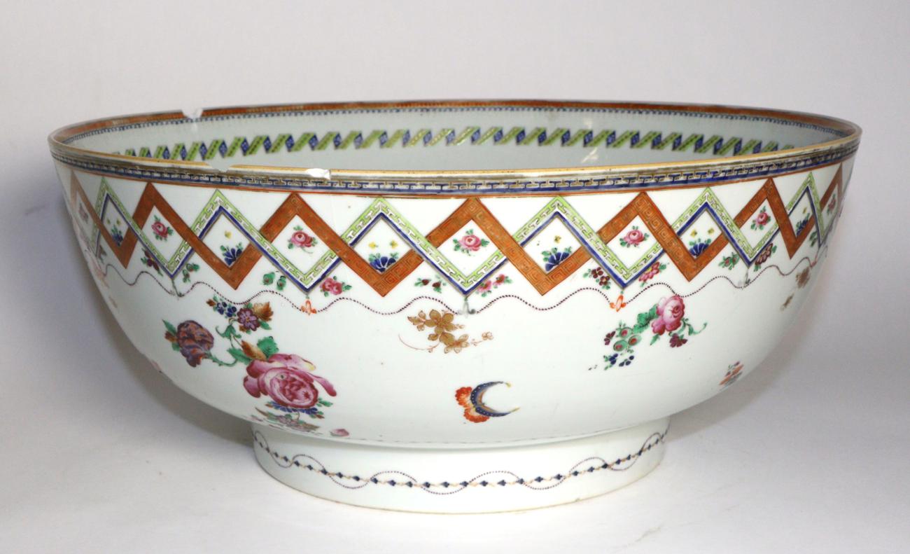A Chinese Porcelain Punch Bowl, Qianlong, painted in famille rose enamels with flowersprays within