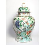 A Chinese Porcelain Baluster Jar and Cover, late 19th century, painted in famille rose enamels