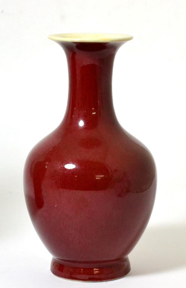 A Chinese Sang de Boeuf Glazed Baluster Vase, Qing Dynasty, with trumpet neck, 20.5cm high