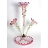 A Pink Vaseline Glass Epergne, with frilled rims, the central trumpet vase flanked by two further
