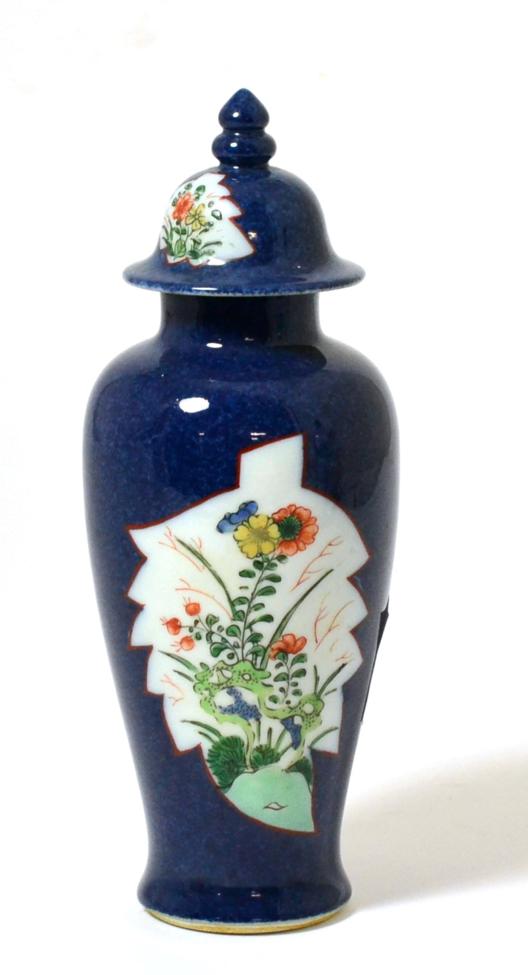 A Chinese Porcelain Baluster Vase and Cover, Qing Dynasty, painted in famille verte enamels with