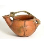 A Pre-Columbian Type Terracotta Pouring Vessel, painted with stylised foliage and with webbing