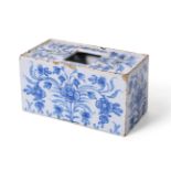 An English Delft Flower Brick, mid 18th century, of rectangular form with large central aperture