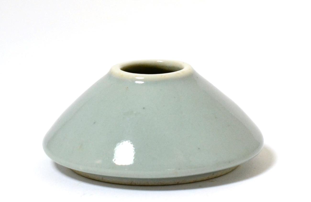 A Chinese Celadon Glazed Conical Brush Pot, bears six character Kangxi reign marks, 8cm diameter