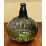 A Green Glass Pharmacy Bottle, 19th century, of shaft and globe form with gilt label inscribed AC: