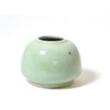 A Chinese Celadon Glazed Brush Pot, Qing Dynasty, of ovoid form, 6cm high